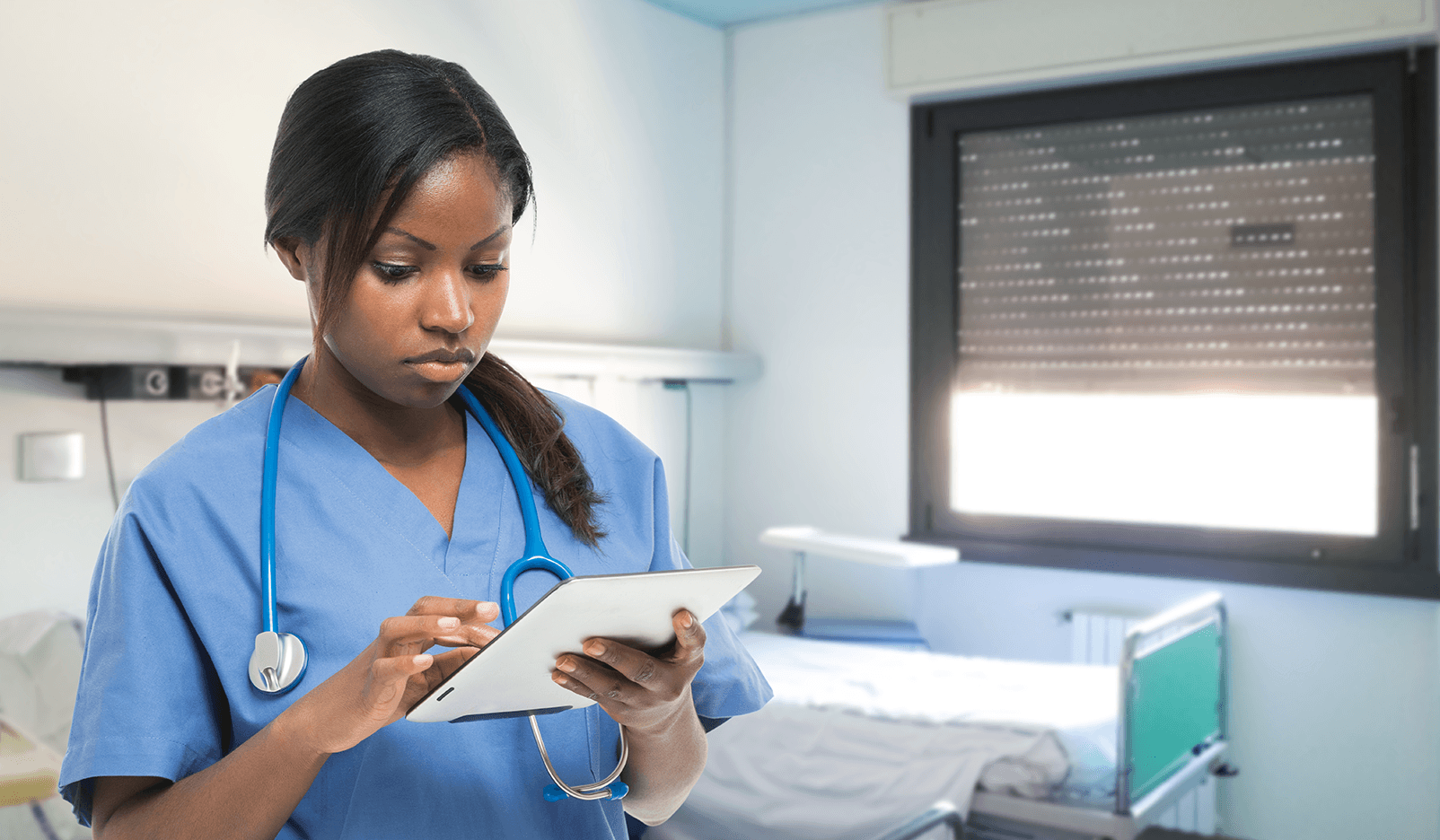 nurse using a tablet